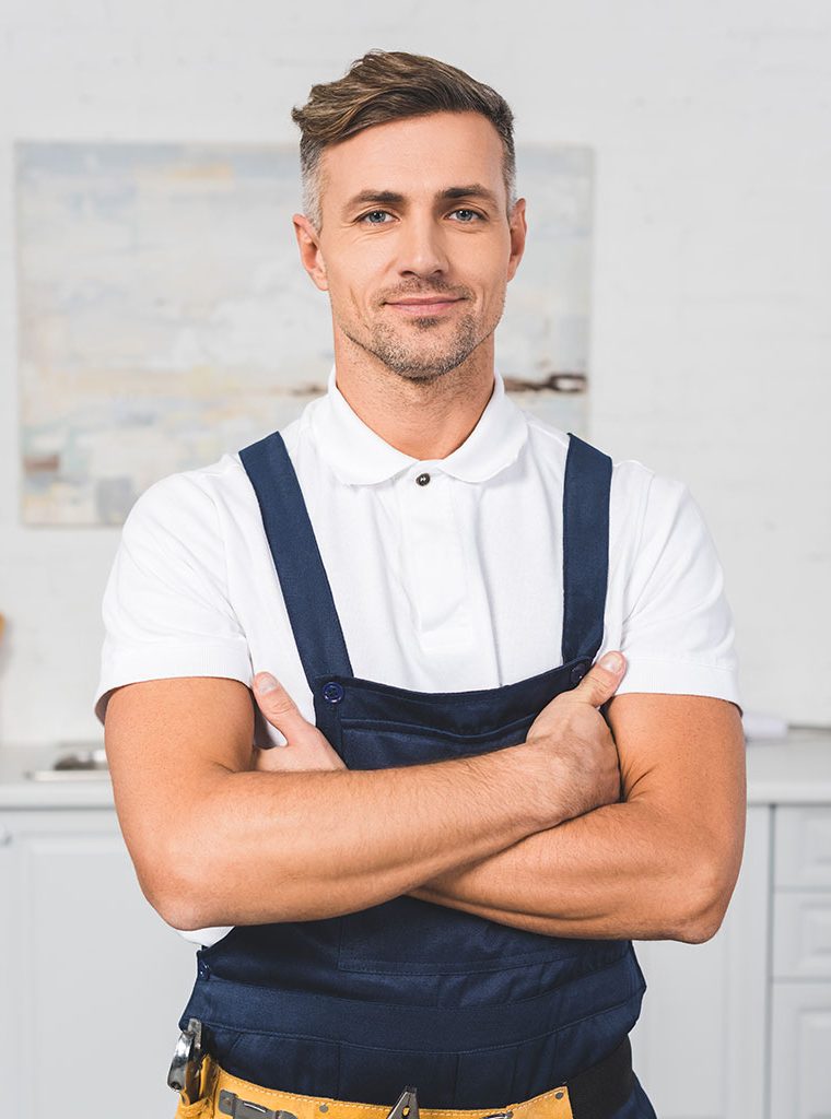 adult-repairman-in-tool-belt-standing-with-crossed-WEJMUQM.jpg
